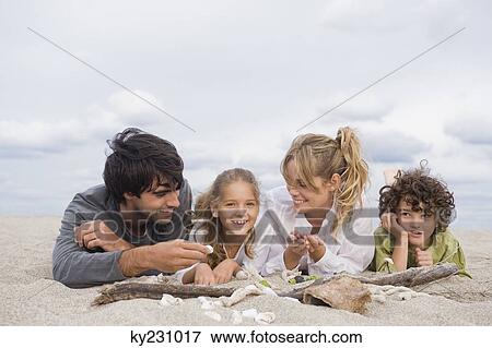 Family on the beach View Large Photo Image Stock Photo - Family on the beach. Fotosearch
