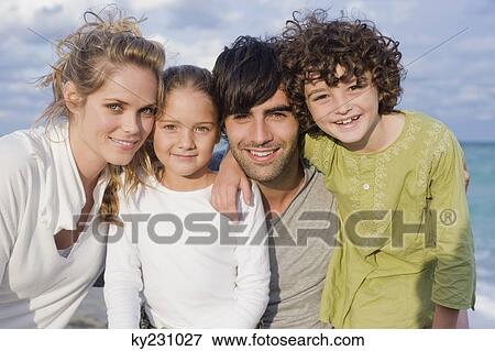 Portrait of a family smiling View Large Photo Image Stock Photo - Portrait of a family smiling. Fotosearch