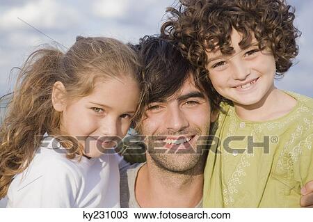 Portrait of a man with his children View Large Photo Image Stock Image - Portrait of a man with his children. Fotosearch