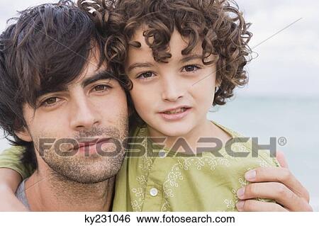 Portrait of a man with his son View Large Photo Image Stock Photograph - Portrait of a man with his son. Fotosearch