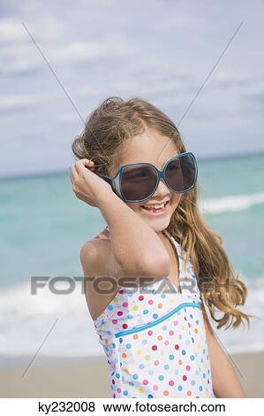 Girl smiling on the beach View Large Photo Image Stock Photo - Girl smiling on the beach. Fotosearch
