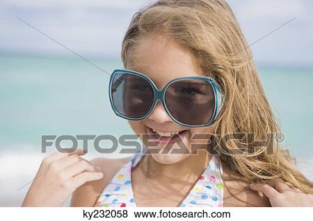 Girl smiling on the beach View Large Photo Image Stock Photo - Girl smiling on the beach. Fotosearch