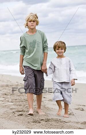 Portrait of two boys on the beach View Large Photo Image Stock Photo - Portrait of two boys on the beach. Fotosearch