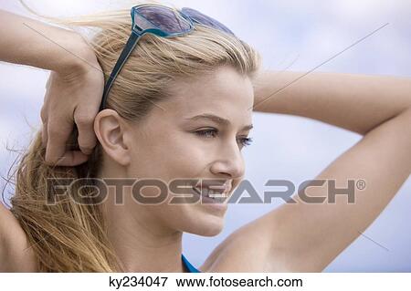 Stock Photo - Close-up of a woman smiling. Fotosearch