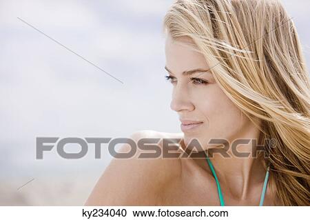 Close-up of a woman thinking View Large Photo Image Stock Image - Close-up of a woman thinking. Fotosearch