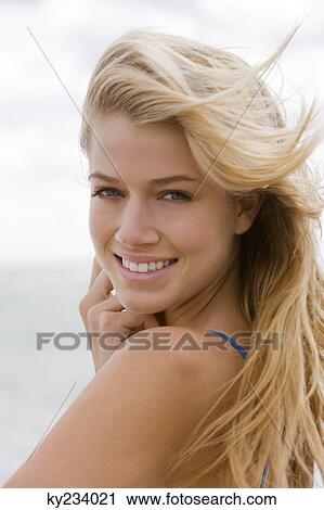 Stock Image - Portrait of a woman smiling. Fotosearch