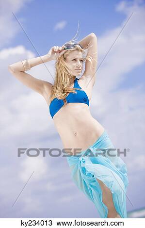 Woman posing on the beach View Large Photo Image Stock Image - Woman posing on the beach. Fotosearch