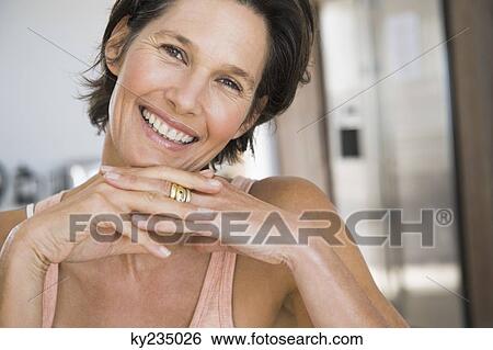 Portrait of a woman smiling View Large Photo Image Stock Photograph - Portrait of a woman smiling. Fotosearch