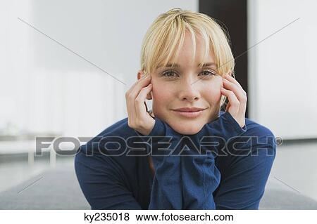 Portrait of a woman with her head in her hands View Large Photo Image Stock Photo - Portrait of a woman with her head in her hands. Fotosearch