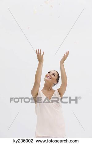 Fashion model posing with her arms raised View Large Photo Image Stock Image - Fashion model posing with her arms raised. Fotosearch