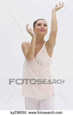 Fashion model posing with her arms raised View Large Photo Image Stock Photography - Fashion model posing with her arms raised. Fotosearch
