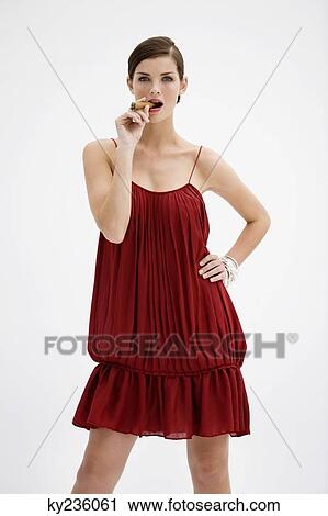 Fashion model smoking a cigar View Large Photo Image Stock Image - Fashion model smoking a cigar. Fotosearch