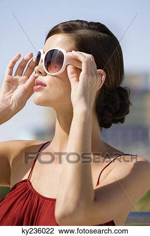 Fashion model wearing sunglasses View Large Photo Image Stock Image - Fashion model wearing sunglasses. Fotosearch