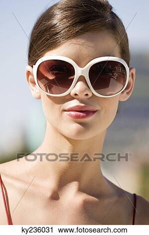 Stock Image - Fashion model wearing sunglasses. Fotosearch