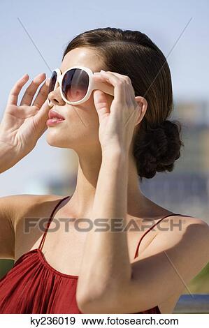 Fashion model wearing sunglasses View Large Photo Image Stock Photo - Fashion model wearing sunglasses. Fotosearch