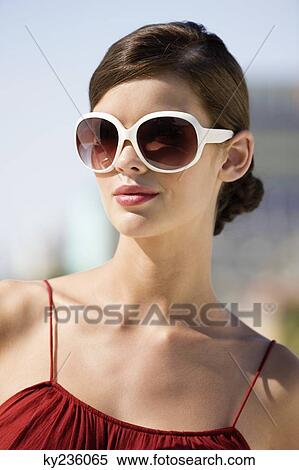 Fashion model wearing sunglasses View Large Photo Image Stock Photography - Fashion model wearing sunglasses. Fotosearch
