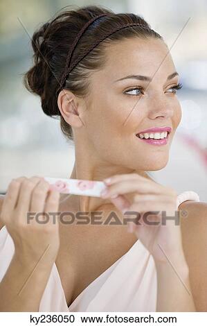 Woman filing nails with a nail file View Large Photo Image Stock Image - Woman filing nails with a nail file. Fotosearch