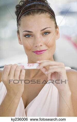 Woman filing nails with a nail file View Large Photo Image Stock Photograph - Woman filing nails with a nail file. Fotosearch