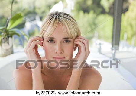 Portrait of a woman in a bathtub View Large Photo Image Stock Image - Portrait of a woman in a bathtub. Fotosearch