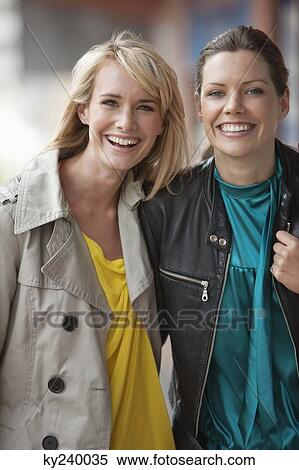 Portrait of two women smiling View Large Photo Image Stock Photography - Portrait of two women smiling. Fotosearch