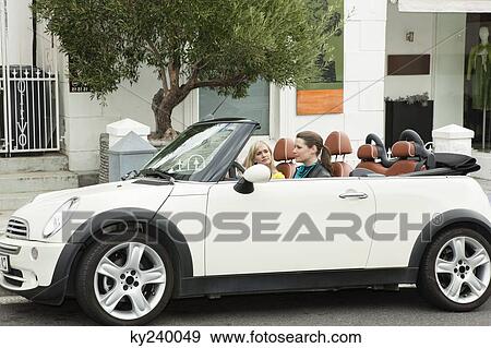 Two women in a car after shopping View Large Photo Image Stock Photo - Two women in a car after shopping. Fotosearch