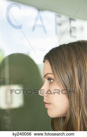 Woman at a cafe View Large Photo Image Stock Photograph - Woman at a cafe. Fotosearch