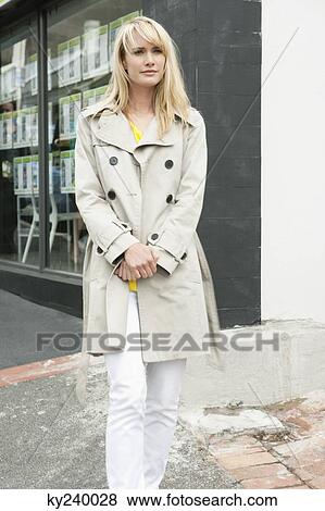 Woman standing on the road and thinking View Large Photo Image Stock Photo - Woman standing on the road and thinking. Fotosearch