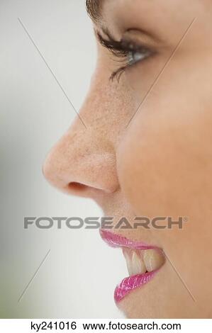 Close-up of a fashion model smiling View Large Photo Image Stock Photograph - Close-up of a fashion model smiling. Fotosearch