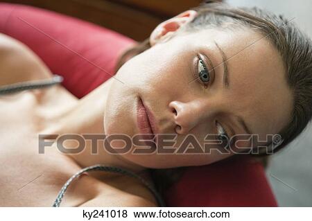 Close-up of a woman looking tired View Large Photo Image Stock Photo - Close-up of a woman looking tired. Fotosearch