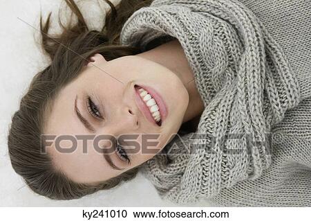 Woman lying on the floor and smiling View Large Photo Image Stock Image - Woman lying on the floor and smiling. Fotosearch