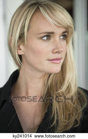 Woman thinking in a cafe View Large Photo Image Picture - Woman thinking in a cafe. Fotosearch