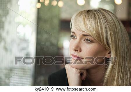Woman thinking in a cafe View Large Photo Image Stock Photo - Woman thinking in a cafe. Fotosearch
