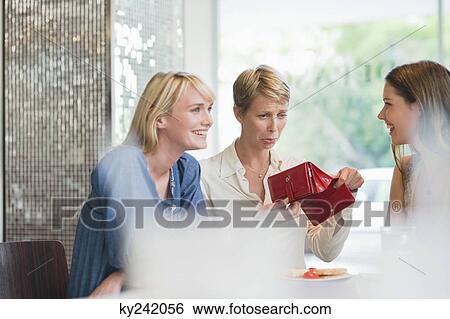 Woman making sad expression after seeing her empty wallet View Large Photo Image Stock Photograph - Woman making sad expression after seeing her empty wallet. Fotosearch