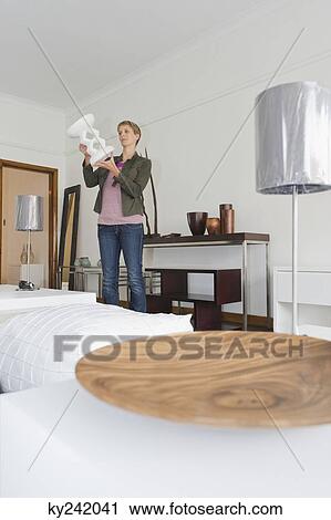 Woman shopping in a furniture store View Large Photo Image Stock Image - Woman shopping in a furniture store. Fotosearch