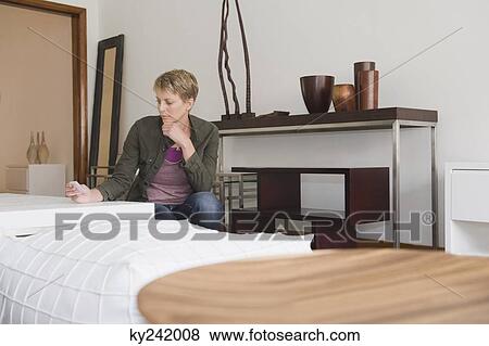 Woman shopping in a furniture store View Large Photo Image Stock Photo - Woman shopping in a furniture store. Fotosearch