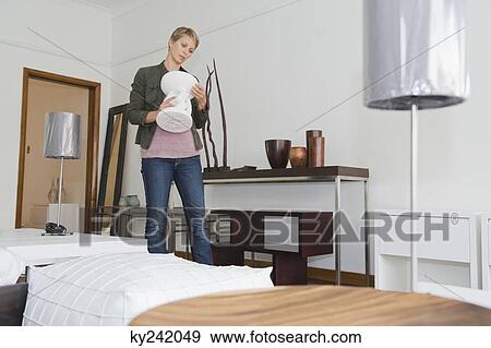 Woman shopping in a furniture store View Large Photo Image Stock Photo - Woman shopping in a furniture store. Fotosearch