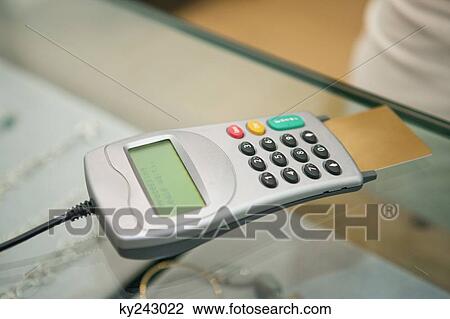 Close-up of a credit card in a reader View Large Photo Image Stock Image - Close-up of a credit card in a reader. Fotosearch