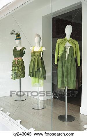 Mannequins in the display window of a boutique View Large Photo Image Stock Image - Mannequins in the display window of a boutique. Fotosearch
