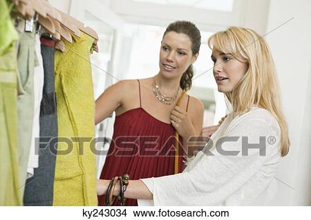 Two women shopping in a boutique View Large Photo Image Picture - Two women shopping in a boutique. Fotosearch