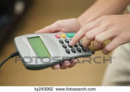 Woman using credit card reader in a boutique View Large Photo Image Stock Image - Woman using credit card reader in a boutique. Fotosearch