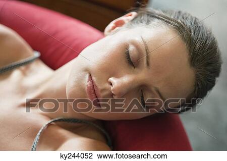 Stock Image - Close-up of a woman napping. Fotosearch