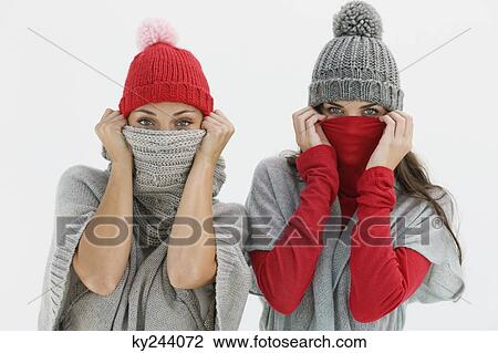 Portrait of two women hiding their faces View Large Photo Image Stock Image - Portrait of two women hiding their faces. Fotosearch