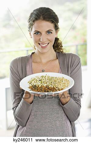 Portrait of a woman having breakfast View Large Photo Image Stock Image - Portrait of a woman having breakfast. Fotosearch