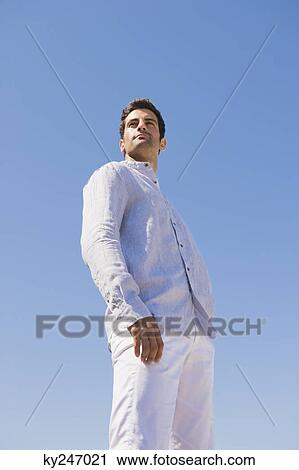 Man standing on the beach View Large Photo Image Stock Image - Man standing on the beach. Fotosearch