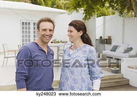 Stock Image - Close-up of a couple smiling. Fotosearch