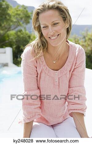 Stock Photo - Close-up of a woman smiling. Fotosearch