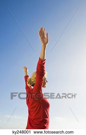 Woman stretching her arms View Large Photo Image Stock Image - Woman stretching her arms. Fotosearch
