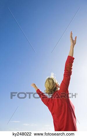Woman stretching her arms View Large Photo Image Stock Image - Woman stretching her arms. Fotosearch