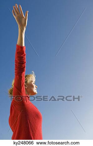 Woman stretching her arms View Large Photo Image Stock Photograph - Woman stretching her arms. Fotosearch