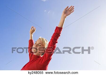Stock Photography - Woman stretching her arms. Fotosearch